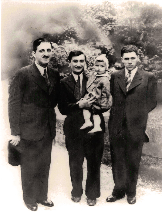 Here is an early photo of Nusia in the arms of her father Hersch Rechter and with her paternal uncle Abraham Abe Rechter and an unknown gentleman.
